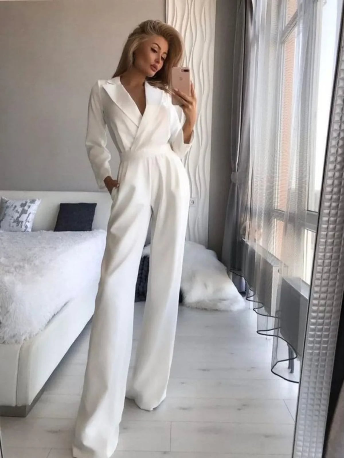 dames getailleerde jumpsuit met wijde pijp in wit