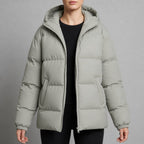 dames gewatteerde puffer jas met capuchon in lichtgrijs