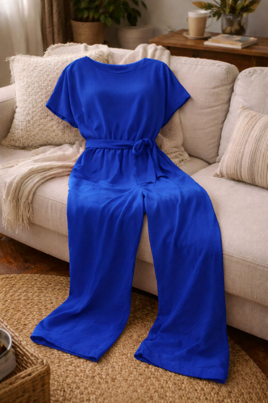 dames jumpsuit korte mouw met strikceintuur in blauw