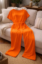 dames jumpsuit korte mouw met strikceintuur in oranje