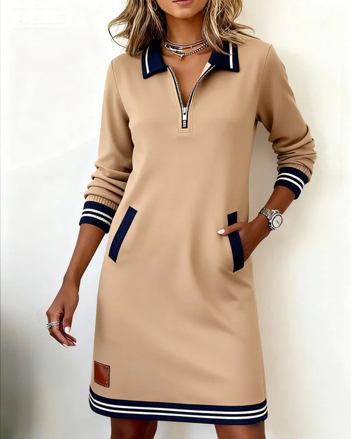dames jurk lange mouwen met polokraag en rits in beige
