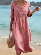 dames midi jurk met v-hals in roze