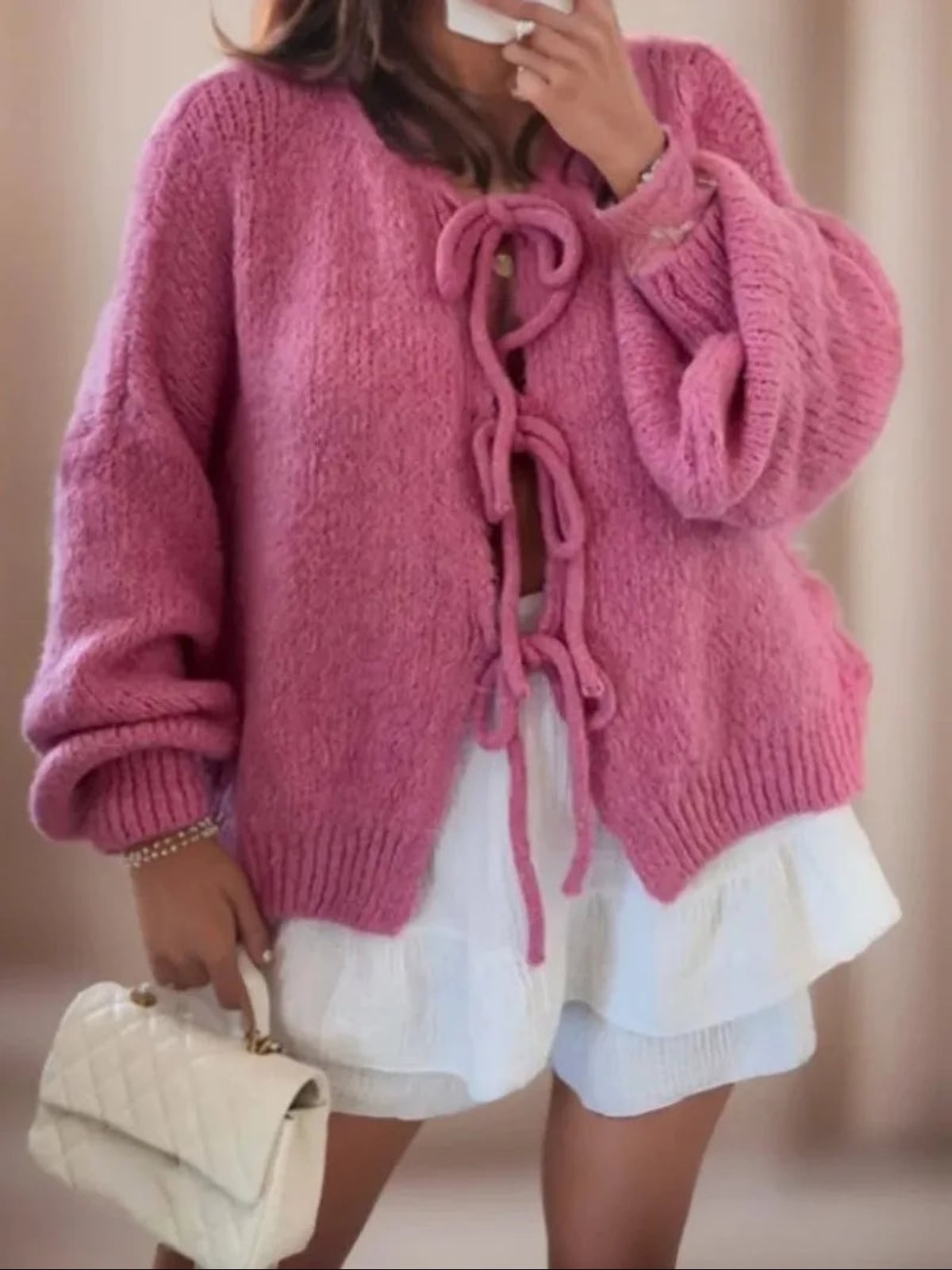 dames oversized vest met striksluitingen in roze
