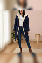 dames pufferjas met capuchon lang in marineblauw