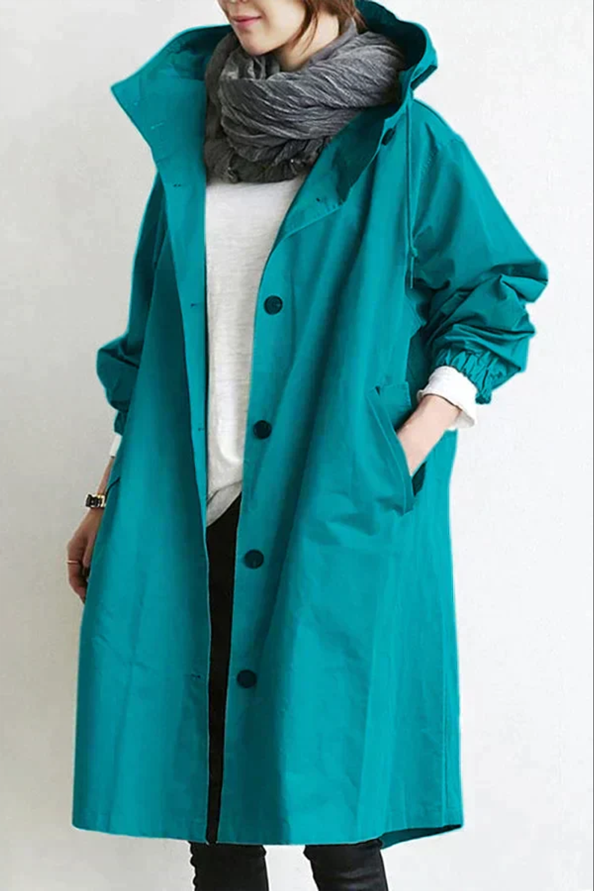 dames regenjas met oversized capuchon blauwgroen 