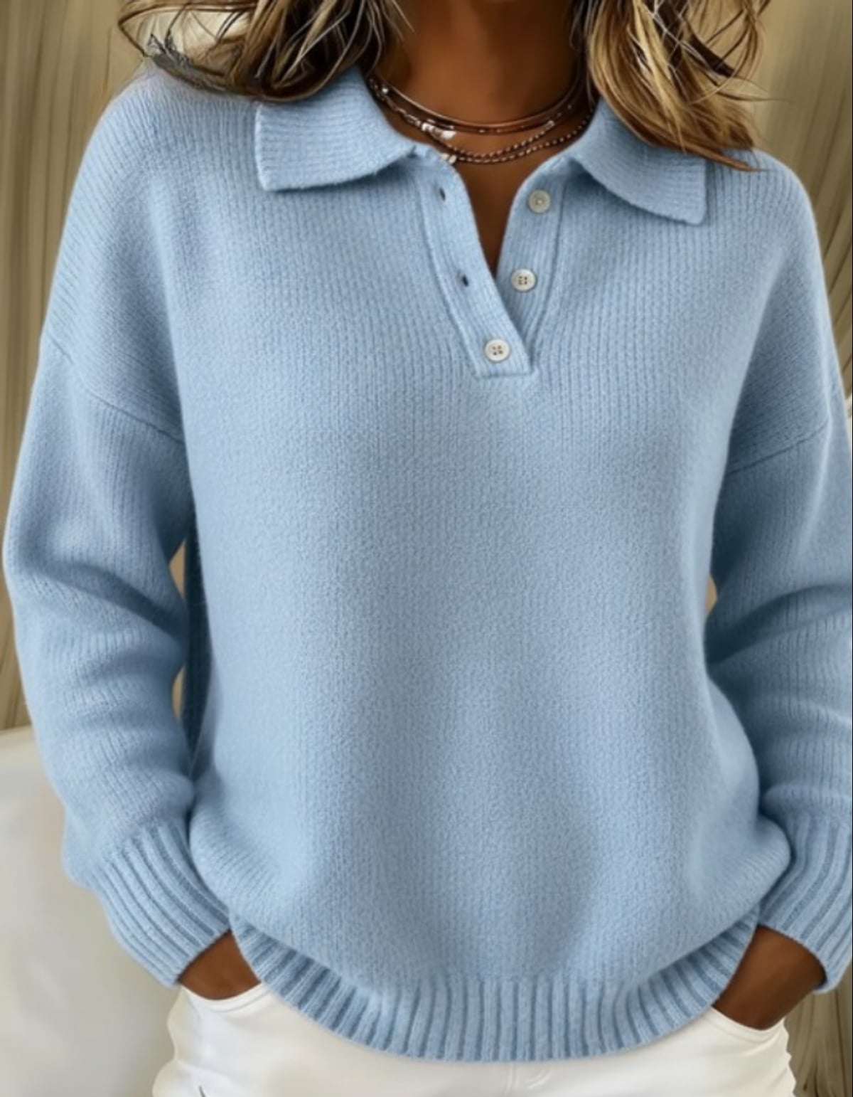 dames trui met polokraag en knoopsluiting in blauw