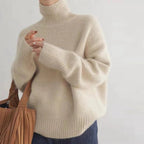 dames trui oversized met rolkraag in abrikoos