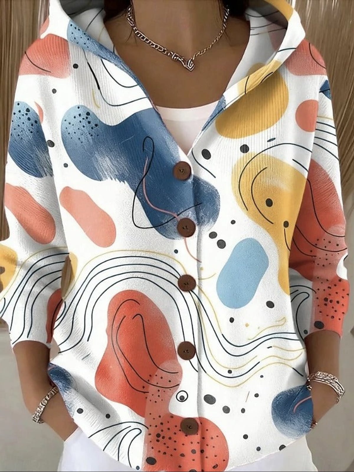 dames vest met capuchon en knoopsluiting in beige