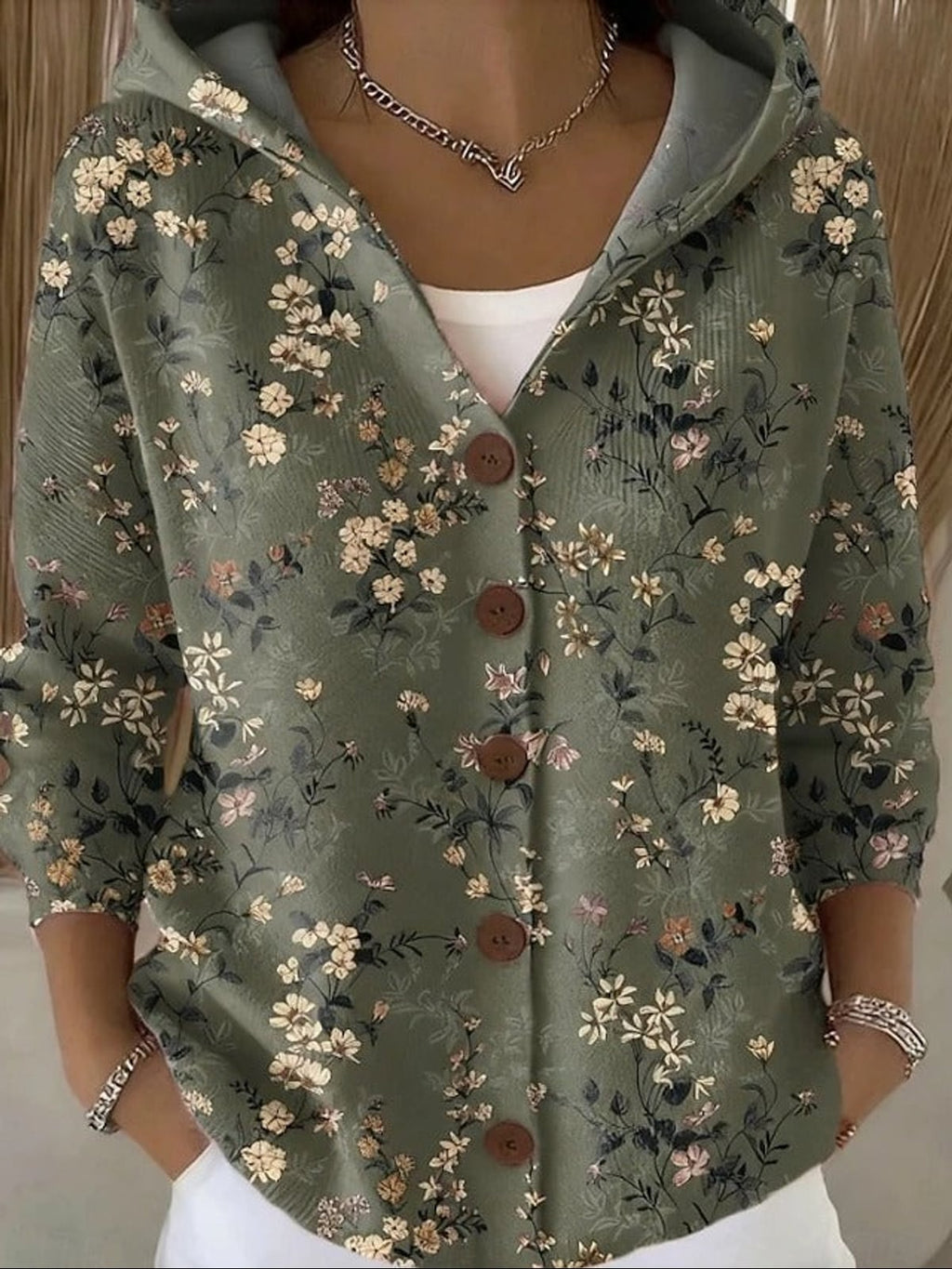 dames vest met capuchon en knoopsluiting in donkergroen