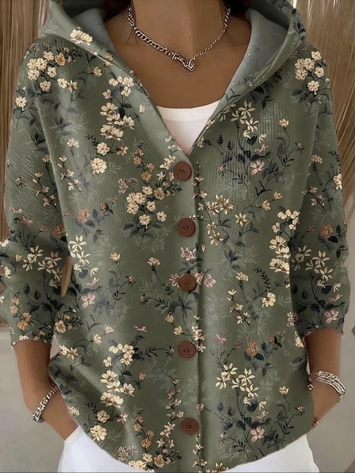 dames vest met capuchon en knoopsluiting in donkergroen