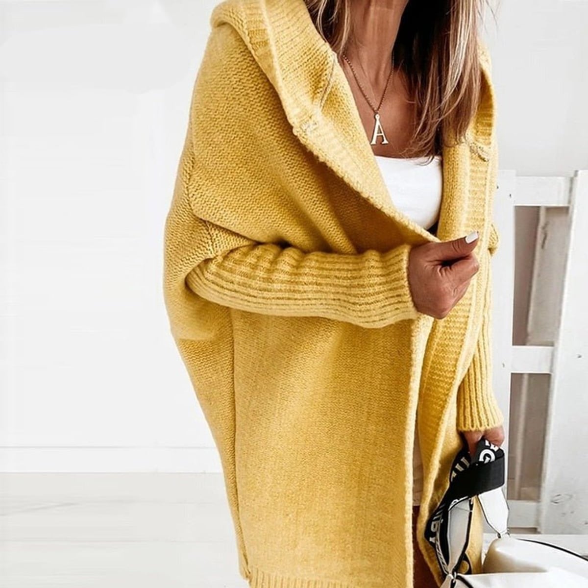 dames vest oversized met capuchon in geel