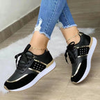 dames vetersneaker met metallic detail in zwart