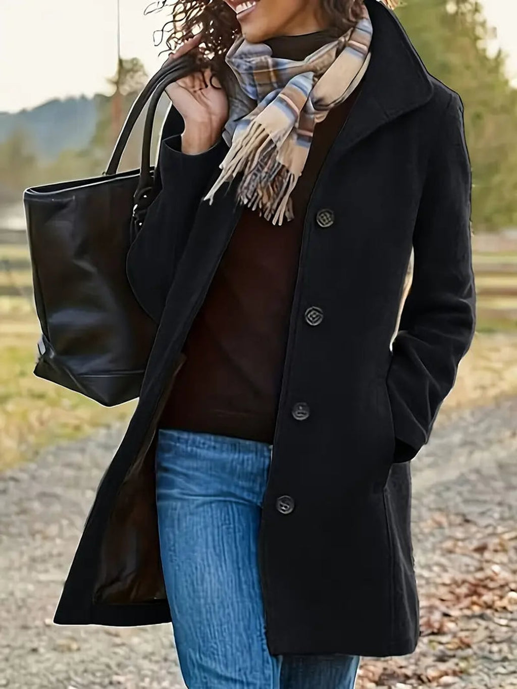 dames winterjas met knoopsluiting in zwart