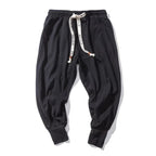 heren relaxed fit harembroek met lage kruisnaad in zwart